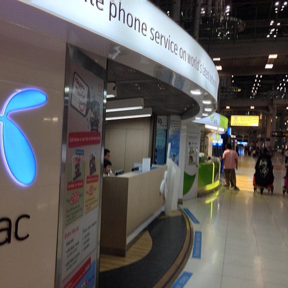 DTAC and AIS carrier kiosks at Suvarnabhumi Airport in Bangkok